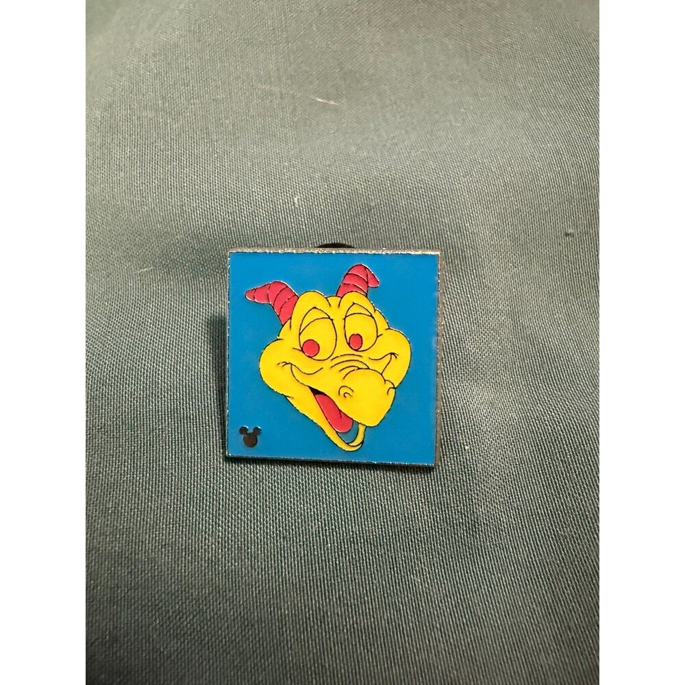 Disney pin featuring Figment from Epcot against a blue and yellow pop-art style